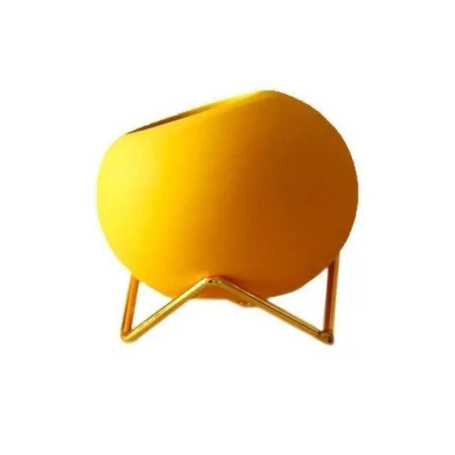 Keramische plantenpot met metalen standaard